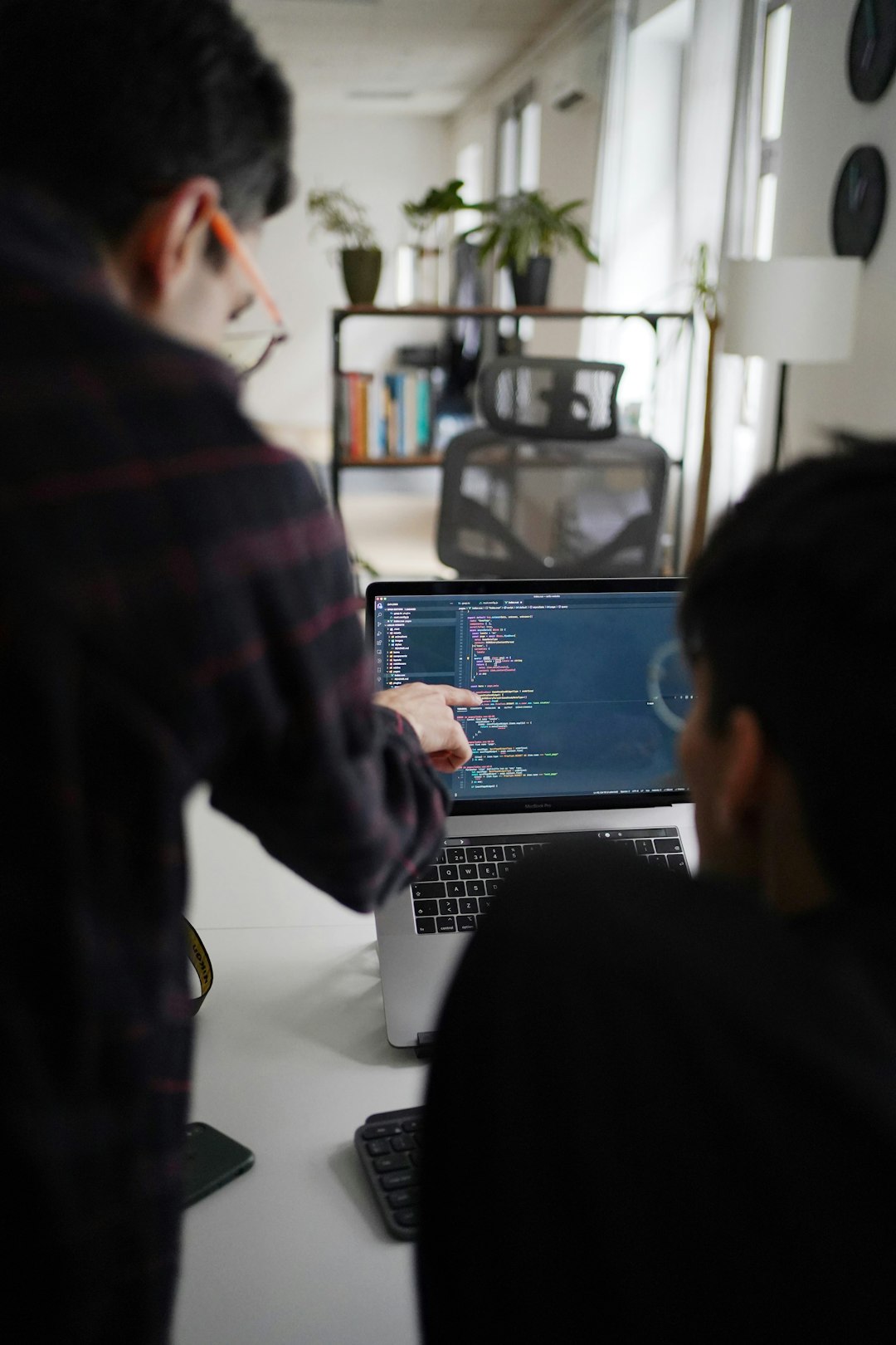 man-in-black-and-red-plaid-shirt-using-black-and-gray-laptop-computer-7obmqz4bfrq